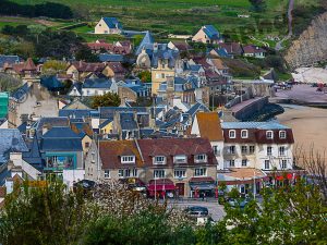 The city of Arromanches, Normandy, France on a bewutiful day .  A quaint village where D-Day took place.  It was hard to imagine that such a horrific time could be remembered at such a place as this.