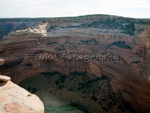 Next to Canyon de Chelly in Chinle, Arizona, is Canyon del Muerto (Canyon of death).  At some point in time, in our illustrious history, the cavalry went in and wiped out a peaceful tribe of cliff-dwelling indians.  You can see the structures in the center left of the image.    20" x 13".  Printed on Parrot Digigraphic Ultra Lustre Photopaper.  Limited Editon of 25 (sold only with Face in Canyon del Muerto).